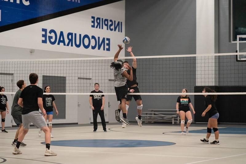 Students playing intramural volleyball.